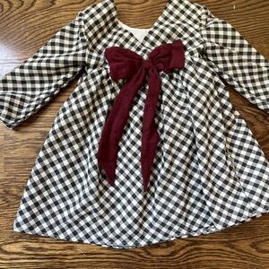Beautiful girls dress with burgundy bow